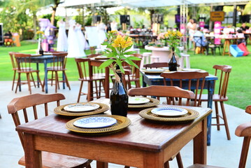outdoor cafe in the morning, table and chairs in a garden, table set,  table set with Turkish ceramics, Turkish porcelain, ornamental flowers
