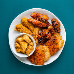 Fried Chicken Wings Nuggets Sauce Drizzled Food Photography Green Backdrop Advertisement Editorial