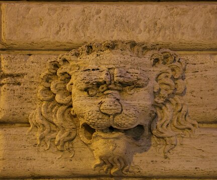 Lion mascaron on a wall