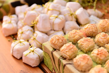 white chocolate candies with hazelnut on the party table, condensed milk candy balls, candy balls