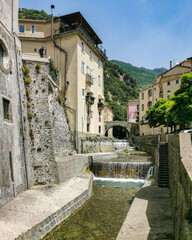 Scenic river with small waterfall crossing the town of Campagna in Salerno province, Campania...