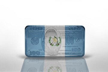 national flag of guatemala on the dollar money banknote on the white background .