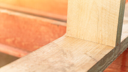 Connection of wooden boards at house construction site