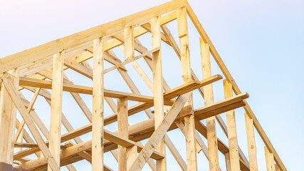 House roof carcass made of boards at construction site