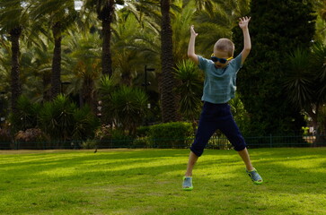 Portrait of a little boy. A child for a walk, fresh air. Baby emotions