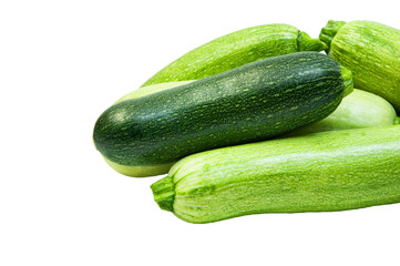 fresh zucchini on a white background. delicious green vegetables on the table. appetizing zucchini on a light texture. healthy food concept