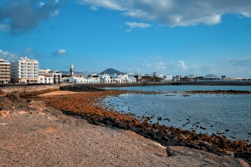 Beautiful shot of the empty beach of Arrecife town on the coast of the Atlantic Ocean