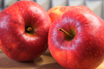 Several ripe red apples, close-up shot. Beautiful fruits.
