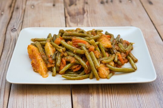 green beans, onion and potatoes stewed in tomato, herbs and olive oil, fasolakia ladera in Greece