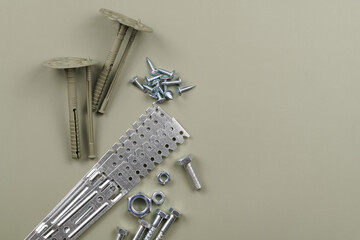 Set of bolts nuts nails metal fasteners. Consumable hardware tools. assortment steel screws collection close up background