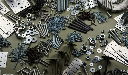 Set of bolts nuts nails metal fasteners. Consumable hardware tools. assortment steel screws collection close up background