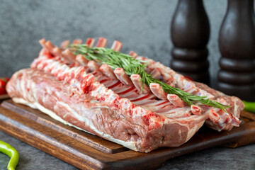 Lamb chops. Whole fresh lamb chop or rib chop on dark background. Butcher products. close up