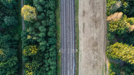 Train tracks through German forest near Munich aerial drone view fotage