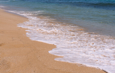 Clear emerald green sea with clean sandy beach