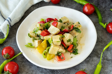 Artichoke Salad. Artichoke salad with olive oil on a dark background. Healthy meals. close up
