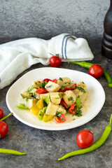 Artichoke Salad. Artichoke salad with olive oil on a dark background. Healthy meals. close up