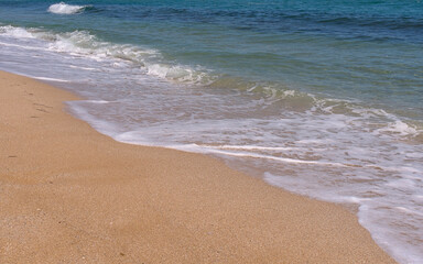 Clear emerald green sea with clean sandy beach