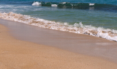 Clear emerald green sea with clean sandy beach