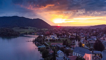 Schliersee lake in south Germany in the Alps with magical colorful sunset from drone view