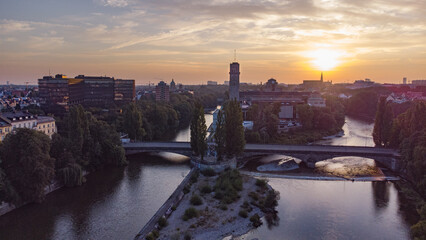 Aerial view of Munich city centre with Isar river flowing past the Deutsches Museum at sunrise