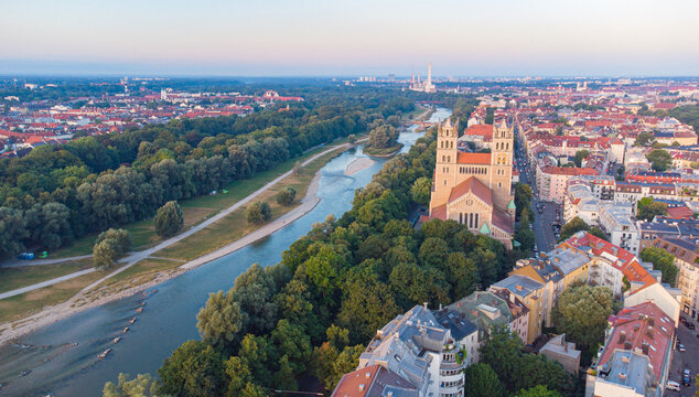 Isar river flowing through the city of Munich in a calm summer morning aerial image