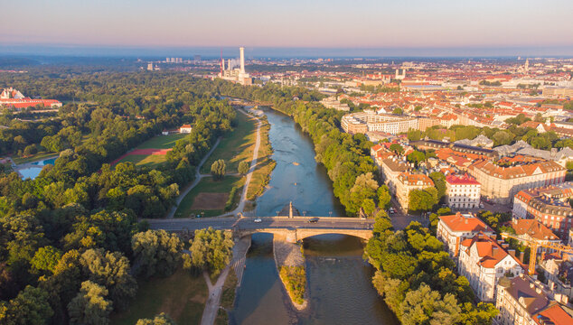 Isar river flowing through the city of Munich in a calm summer morning aerial image