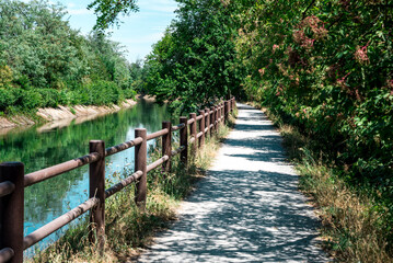 Fototapeta premium Villoresi Canal, Metropolitan City of Milan, Italy - 07 09 2022: This photo was taken near the Villoresi Canal, a typically Italian marvelous place. 