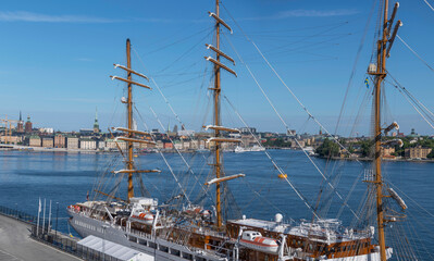 Panorma view from a vista point over the bay Saltsjön, cruise sailing ship and skyline of the old town Gamla Stan, a sunny summer day in Stockholm