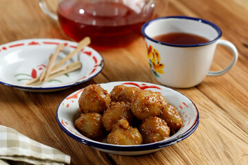 Cilok is Aci Dicolok, Traditional Street Food from West Java, Made from Tapioca or Aci Flour. Cilok is a Round Shaped Snack with a Chewy Texture, Served with Peanut Sauce