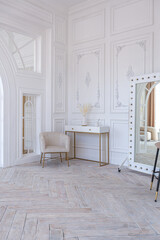 snow-white luxury apartment interior with Egyptian-style decor with light stylish furniture. huge panoramic windows and an archway. minimalism and simplicity with the elegance of modern housing design