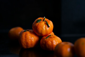 tangerinas on black background