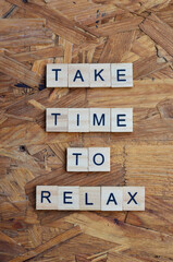 take time to relax text on wooden square, health quotes