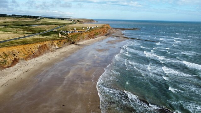 Aerial view of the sunny Compton Beach at the Isle of Wight