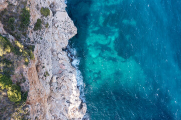 Aerial view of waves splashing on beach