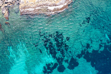 Aerial view of waves splashing on beach