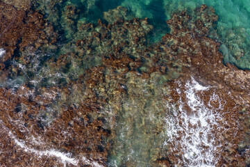 Aerial view of waves splashing on beach
