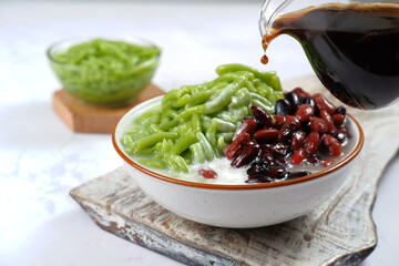 Malaysian Desserts Called Cendol. Cendol is Made From Crushed Ice Cubes,pandan short vermicelli and...