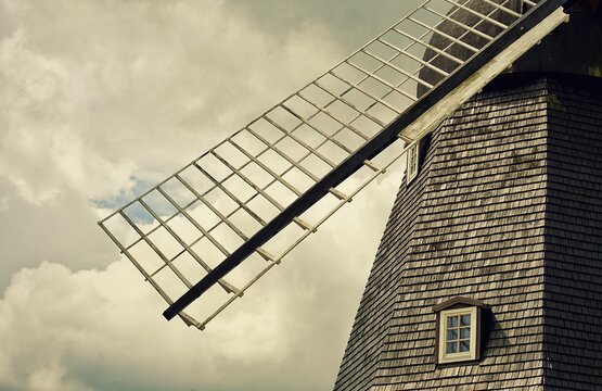 Beautiful shot of an olf windmill against the cloudy sky