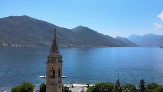 Drone footage of a catholic church by the sea in Dobrota, Montenegro
