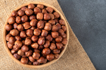 Top view of a bowl full of hazelnuts