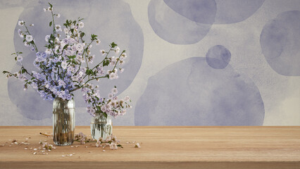 Wooden table, desk or shelf close up. Branches of cherry blossoms in glass vase. Plaster painted wall in purple tones with copy space, template, mock up, spring concept