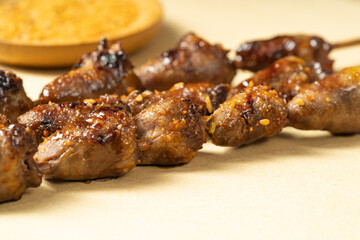 BBQ Chicken Heart Skewers on Kraft Paper