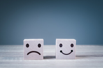 wood cube happyness and sad face icon. Service rating, ranking, customer review, satisfaction and emotion concept