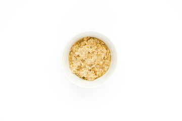 A bowl of oatmeal with blueberries on a white banner with space for text. English breakfast . Healthy food concept.