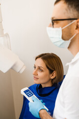 Teeth x ray scanning for detect toothache and treat roots. Dentist do x-ray tooth scan for woman in dentistry.