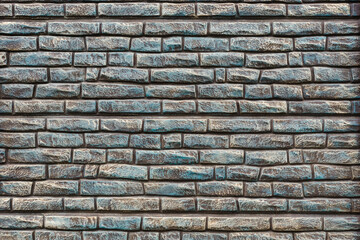 Empty background of turquoise brick wall texture. Modern brick wall concrete or stone seamless textured. Grid uneven interior rock. Home decor design backdrop.