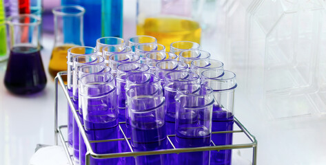 Research laboratory work table with material for chemical experiments. Chemistry laboratory equipment with test samples in glass tubes
