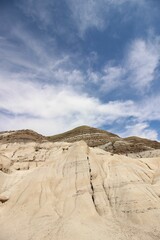 Vertical low angle shot of the hoodoos (the Badlands) in Alberta, Canada