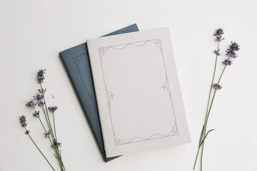 Summer lifestyle floral composition.Blue and grey diary cover, book mockups scene with lavender...