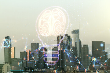 Double exposure of abstract virtual creative light bulb hologram with human brain on Los Angeles city skyscrapers background, idea and brainstorming concept